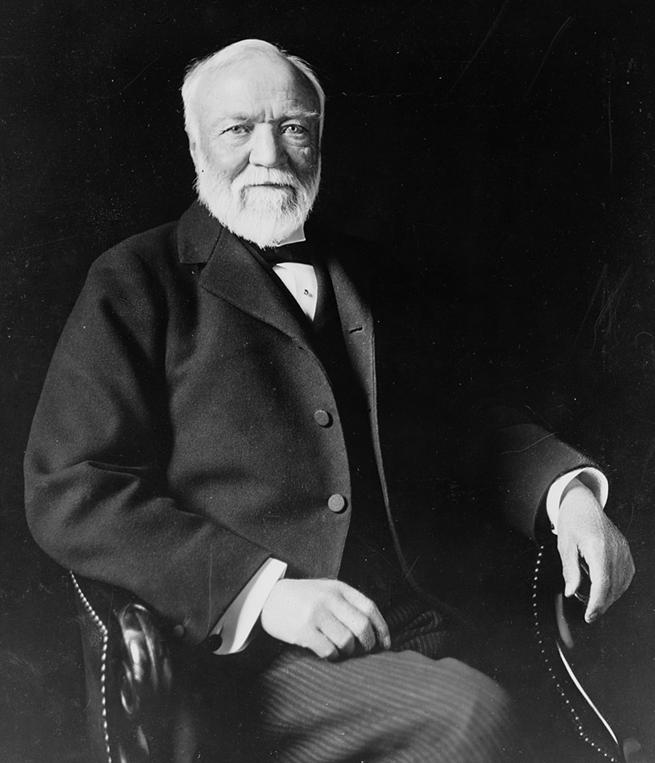 https://upload.wikimedia.org/wikipedia/commons/thumb/b/b5/Andrew_Carnegie%2C_three-quarter_length_portrait%2C_seated%2C_facing_slightly_left%2C_1913.jpg/879px-Andrew_Carnegie%2C_three-quarter_length_portrait%2C_seated%2C_facing_slightly_left%2C_1913.jpg